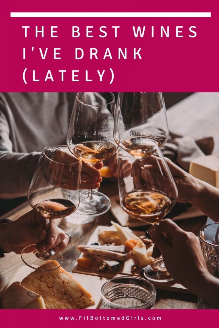 people drinking wine at a table and cheers