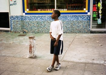 Image may contain Human Person Shorts Clothing Apparel Footwear Shoe Path Walkway Pedestrian and Sidewalk