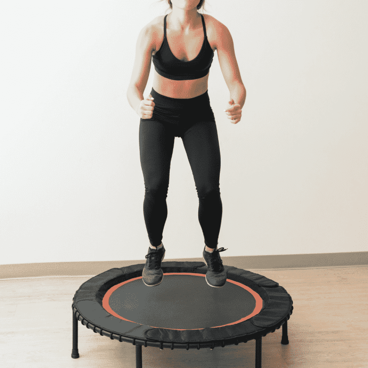 woman jumping on mini-trampoline