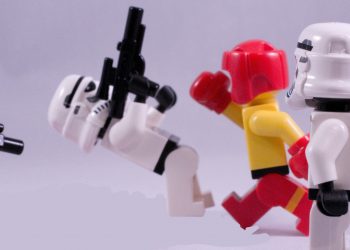 A LEGO boxer, who clearly jumps rope, fighting some stormtroopers.