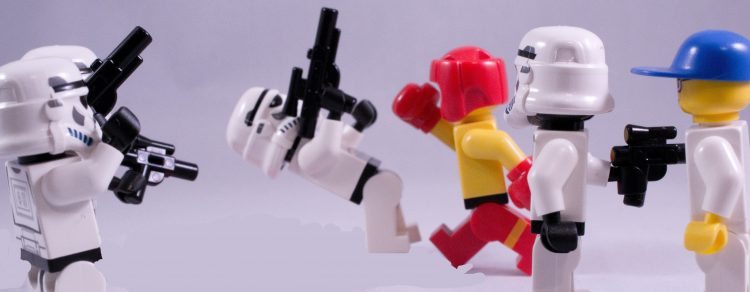 A LEGO boxer, who clearly jumps rope, fighting some stormtroopers.