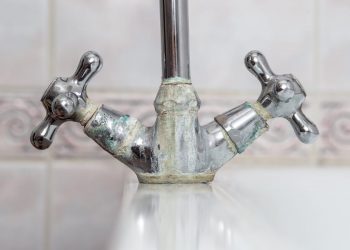 signs of hard water faucet