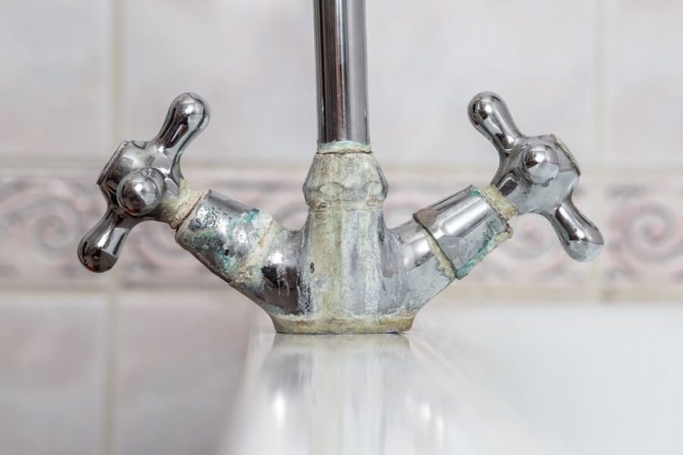 signs of hard water faucet