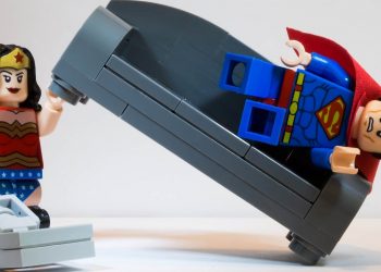 Wonder Woman vacuuming at home