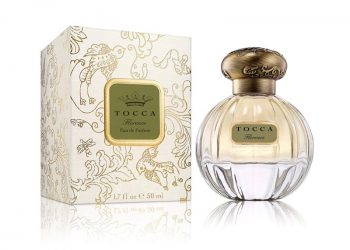 Tocca Florence Eau de Parfum small round bottle of pale gold perfume and round bronze cap and gold detailed box on white background