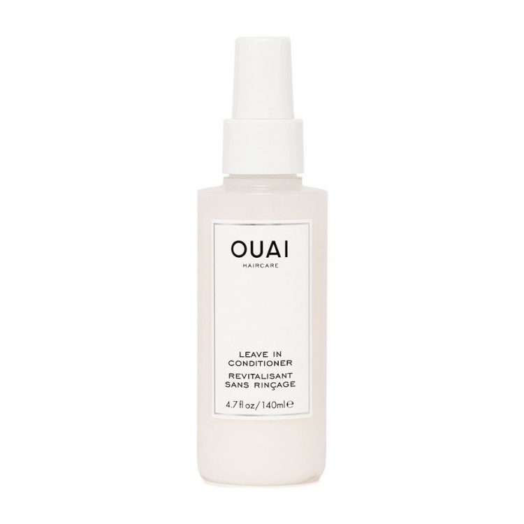 Ouai Leave-In Conditioner spray bottle of white leave-in conditioner on white background