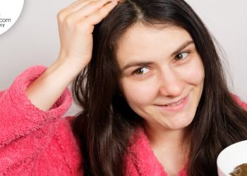 Woman applying scalp scrub