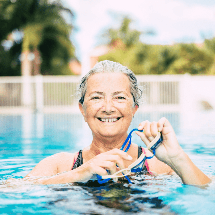 senior woman working out in pool