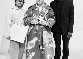 Image may contain Human Person Clothing Apparel Shoe Footwear Sleeve Suit Coat Overcoat People Costume and Face