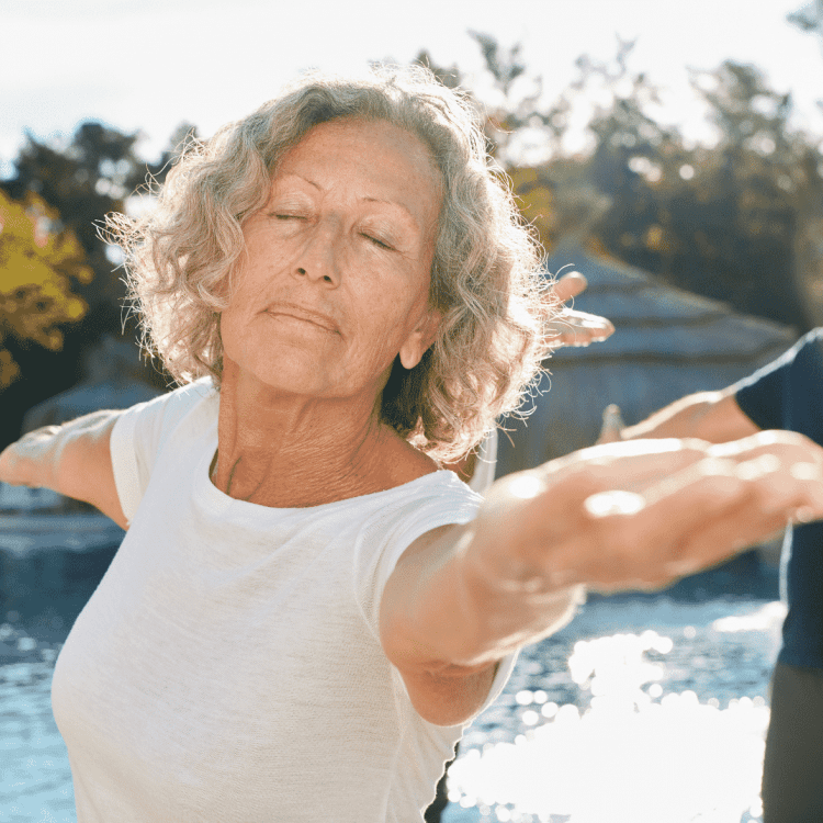 mature woman with eyes closed in yoga pose