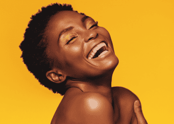 yellow background and smiling woman