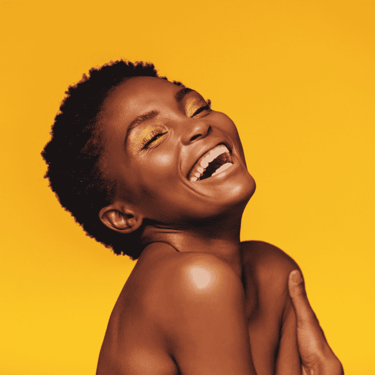 yellow background and smiling woman