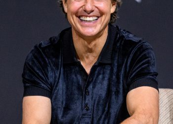 Tom Cruise smiles during a press conference for the film 'Top Gun Maverick' in Seoul