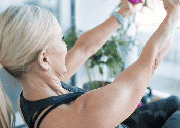 50 year old woman lifting weights
