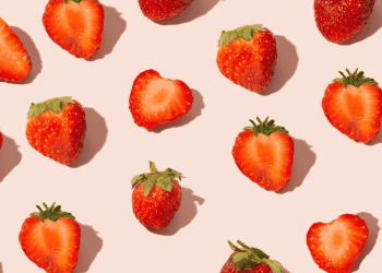 graphic photo of flat lay strawberries on pink background