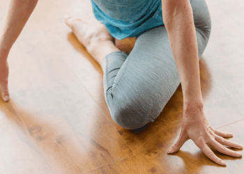 woman doing pigeon pose stretch