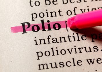 The tip of a pink highlighter pen running over the word "Polio;" a few words from a definition of the illness are also shown