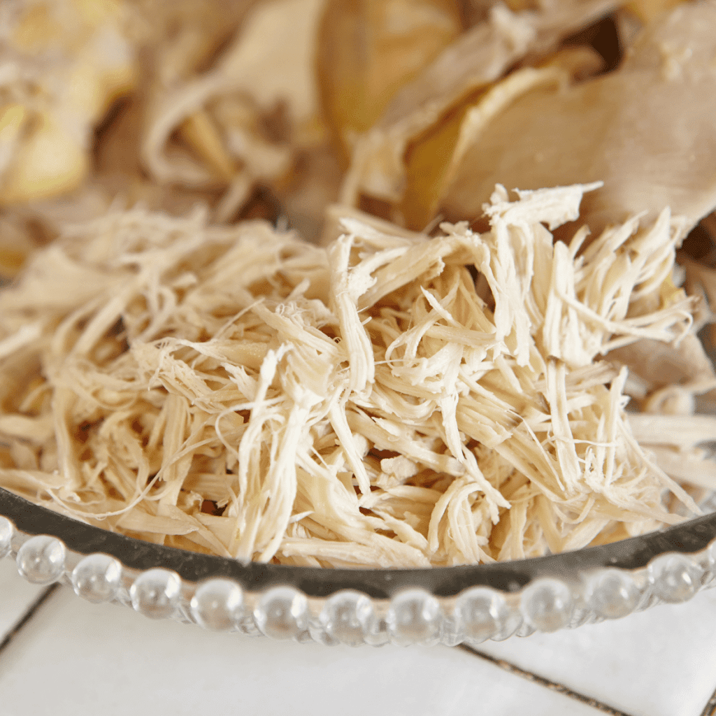 clear bowl of shredded chicken