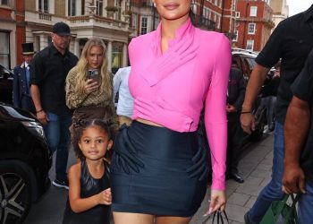 Kylie Jenner and Stormi Webster Spied Out in London in Pink and Black Hand Embellished Fall 2007 Comme Des Garcons Top and Skirt