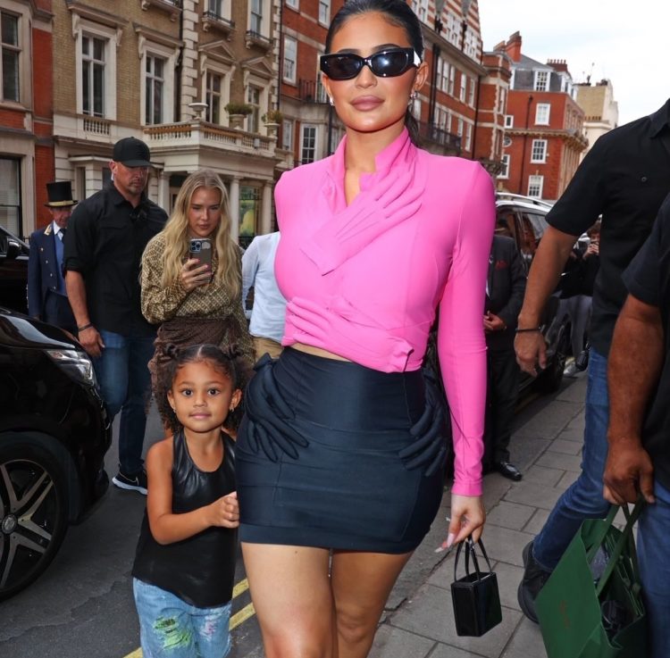 Kylie Jenner and Stormi Webster Spied Out in London in Pink and Black Hand Embellished Fall 2007 Comme Des Garcons Top and Skirt