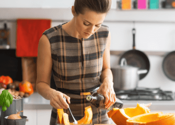 woman cooking a pumpkin
