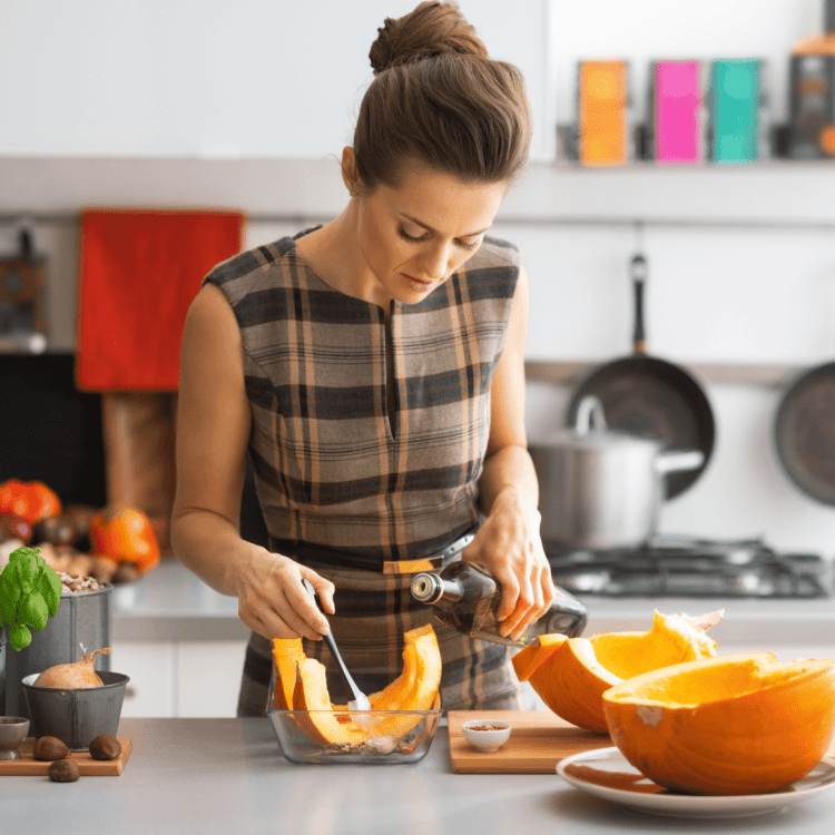 woman cooking a pumpkin