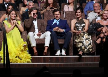 Image may contain Audience Crowd Human Person Olivia Wilde Harry Styles Clothing Shoe Footwear and Apparel