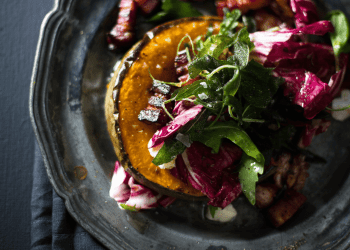 black plate with salad