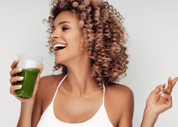 woman drinking green smoothie