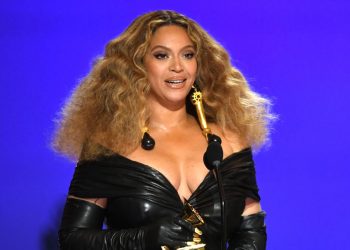 Beyoncé Wears Sleeveless Form Fitting Gown With Bright Pink Opera Gloves