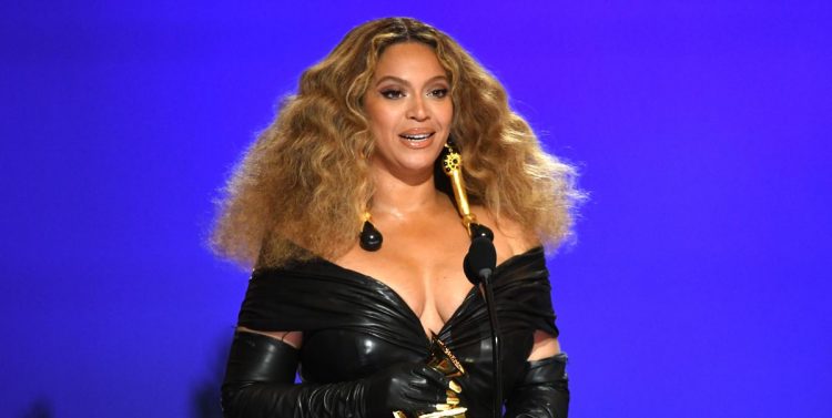 Beyoncé Wears Sleeveless Form Fitting Gown With Bright Pink Opera Gloves