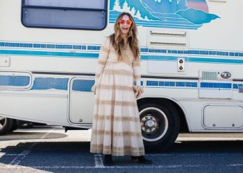 Kristen Phillipkoski in front of the vintage camper.
