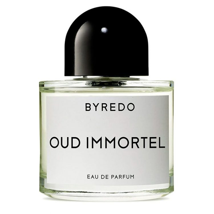 A glass perfume bottle filled with the Byredo Oud Immortel Eau de Parfum on a white background