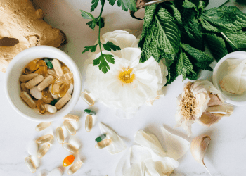 table with natural herbs and supplements for healing