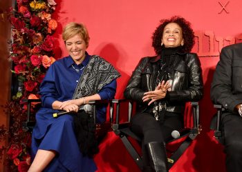 Lucy Betancourt and Linda Villalobos laughing on stage during a panel hosted by Netflix and Allure